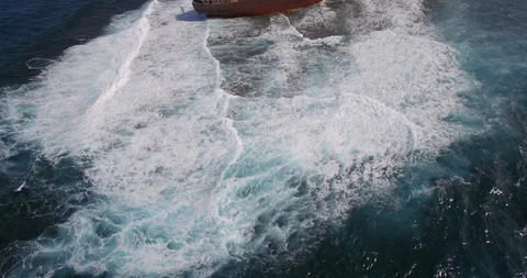 Old shipwreck in hi waves Stock Footage 90526232