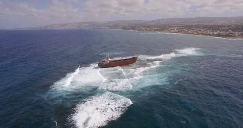 Old shipwreck in hi waves Stock Footage 90526433