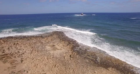 Old shipwreck in hi waves Stock Footage 90526538