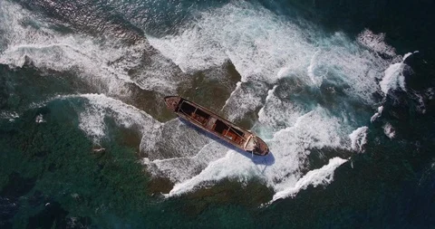 Old shipwreck in hi waves Stock Footage 90537394