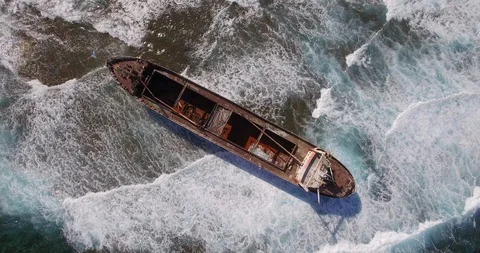 Old shipwreck in hi waves Stock Footage 90537533