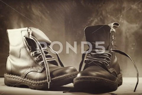 Old shoes close up shot against grunge backgrounds Stock Photos