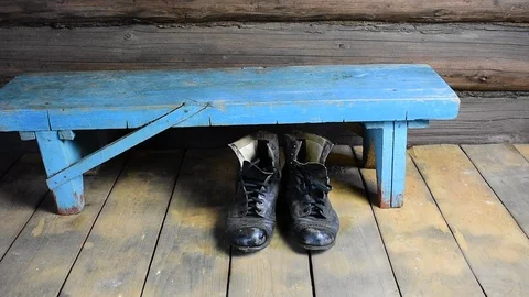 Old shoes under the bench, top view Stock Footage 116021862