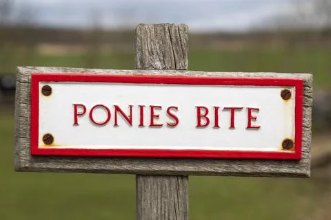 Old sign - Ponies Bite Stock Photos