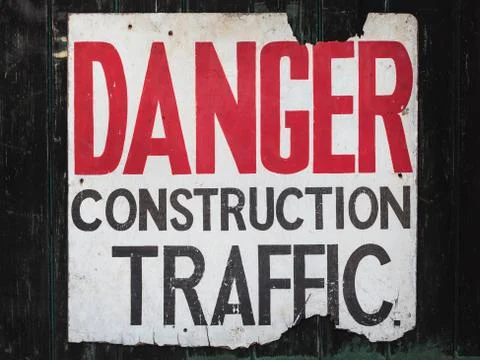 Old sign with text danger construction traffic Stock Photos