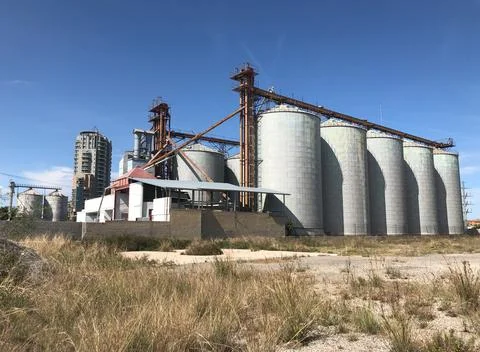 Old silos granary elevator on agro-processing manufacturing plant Stock Photos