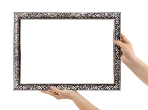 Old silver picture frame in hands Stock Photos