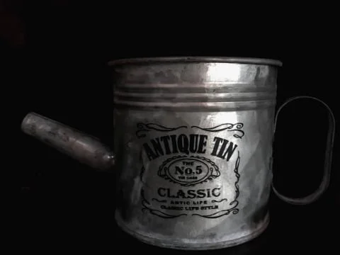 Old silver pots on black background Stock Photos