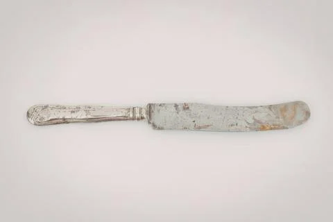 Old silver table knife with tarnished finish Stock Photos