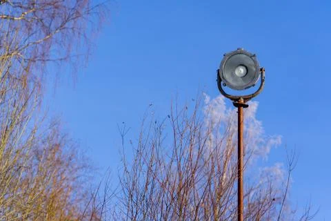 Old single street light on a background of blue sky in the forest. vintage Stock Photos