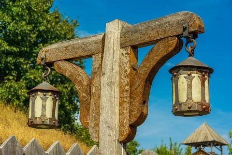 Old Slavic lantern. Pole with lanterns. Stock Photos