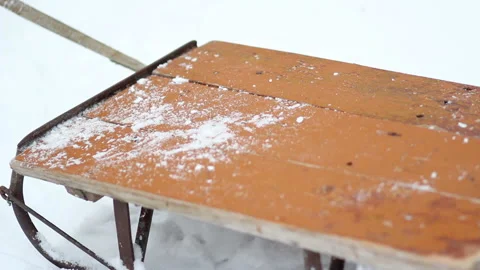Old sledges stand in the snow on a winter day. Stock Footage 118763369