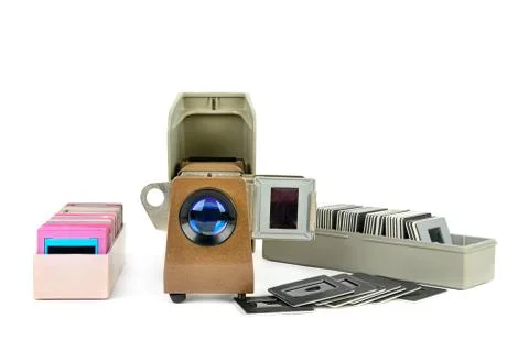 Old slide projector and set of slides isolated on white background. Free spac Stock-Fotos