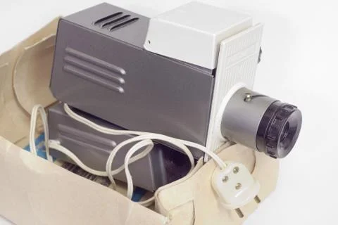 Old slide projector in a box. Close-up Stock Photos
