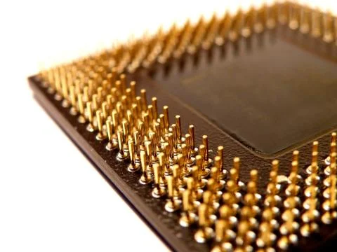 Old slow processor with lot of gold pins on white background Fotos Stock