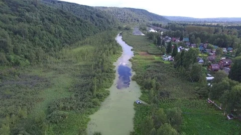 Old small river and village Stock Footage 73860707