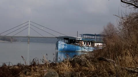 An old small ship on the river bank Video stock 328508258