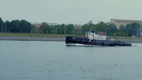 An old small ship sails along the city canal. it's raining Stock Footage 161100873