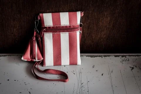 Old small wallet on white table Stock Photos