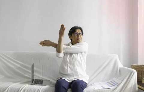Old smart lady doing activity for relax time at living room Stock Photos