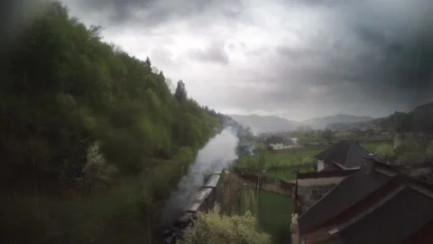 An Old Smoky Train on a Rainy Day Stock Footage 233660341
