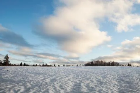 Old snow with clouds Stock Photos