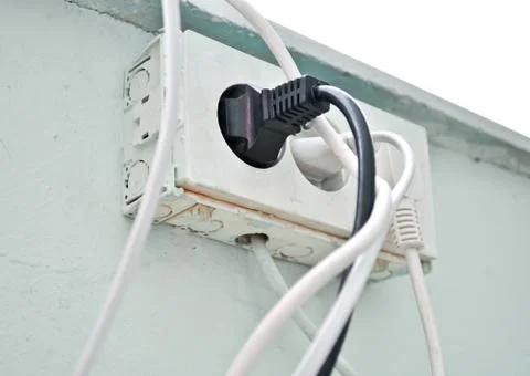The old socket with three plugs Stock Photos