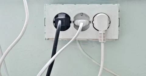 The old socket with three plugs Stock Photos