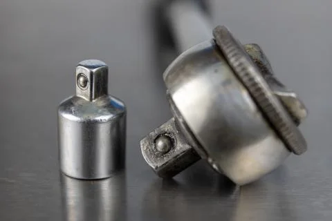 Old socket wrenches with a handle. Accessories for a workshop mechanic on a t Stock Photos