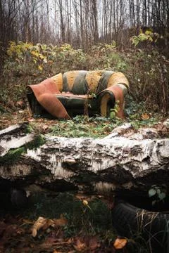 Old sofa in the woods Stock Photos