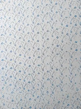 Old Soviet aged white wallpaper on the wall of an abandoned house, textured. Stock Photos