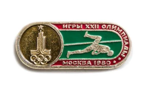 Old Soviet badge is dedicated to a sporting event. Caption: Games of the XX.. Stock Photos