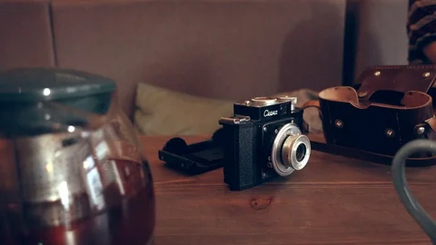 Old soviet camera on table Stock Footage 111837754