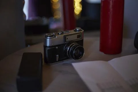 An old Soviet camera is on the table in the studio Stock Photos