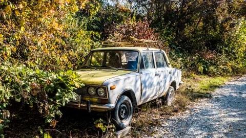 Old Soviet car abandoned in the forest Stock Photos