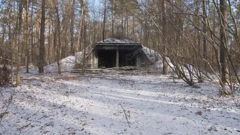 An old Soviet Cold War ballistic nuclear missile storage hangar between the USSR Stock Footage 295548562