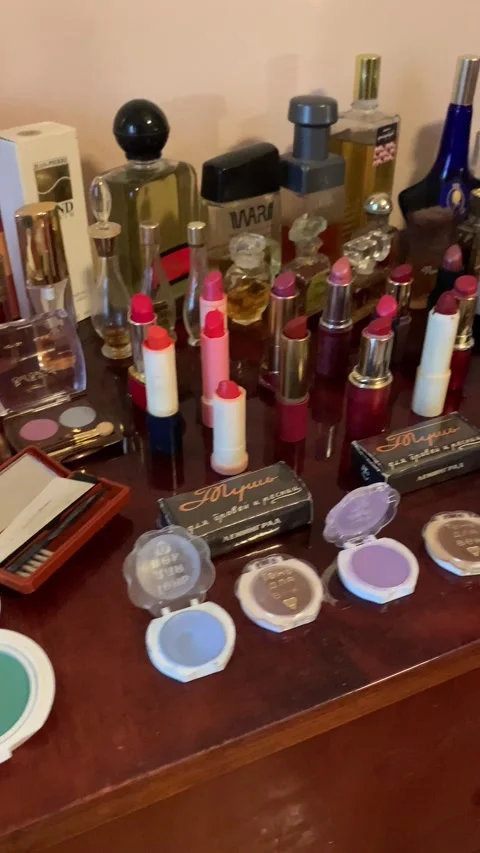 Old Soviet cosmetics on the table. Lipstick, powder, perfume, eye shadow. Stock-Footage 234445867