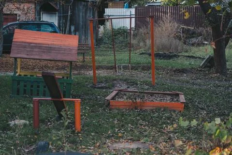 The old Soviet courtyard. The old Soviet playground on the street, in autumn Stock Photos