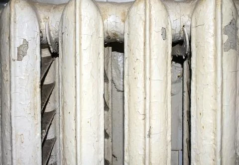 An old Soviet heating battery.Radiator for indoor heating. Stock Photos