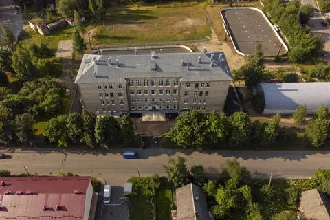 Old Soviet high school facility with football and hockey fields. Aerial view Stock-Fotos