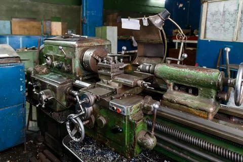 Old Soviet lathe, machine tool equipment. Locksmith shop in the railway depot Stock Photos
