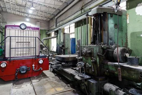 Old Soviet lathe, machine tool equipment. Locksmith shop in the railway depot Stock Photos
