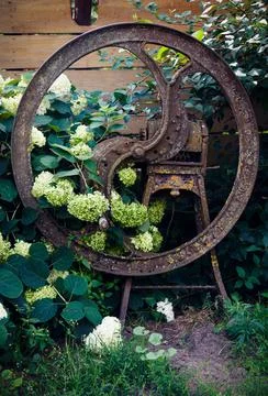 An old Soviet mechanical device for grinding cereals to feed cattle Stock Photos