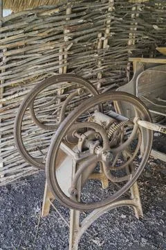An old Soviet mechanical device for grinding cereals to feed cattle Stock Photos