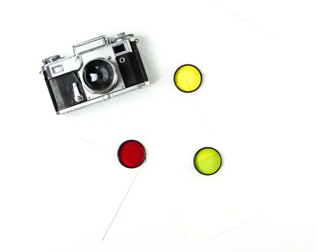 Old soviet rangefinder analog camera top view on an old table with film. Stock Photos