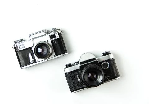 Old soviet rangefinder analog camera top view on an old table with film. Stock-Fotos