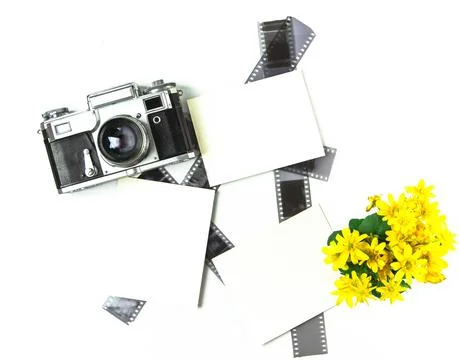 Old soviet rangefinder analog camera top view on an old table with film. Stock Photos