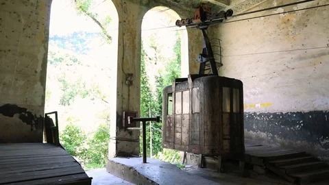 Old soviet rusty and functioning ropeway or cable car cabins in Chiatura Stock Footage 101969261