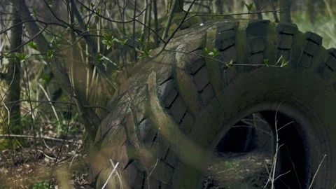 Old Soviet Tire Stuck in the Ground Stock Footage 139691350