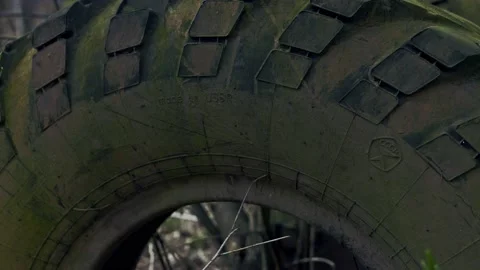 Old Soviet Tire Stuck in the Ground Stock Footage 139691376